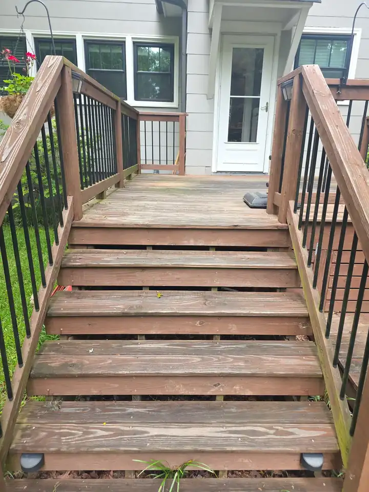 Weathered wood deck stairs with algae and discoloration before pressure washing at a residential home in East Point, GA
