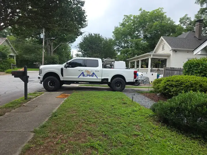 Alpha Pressure Washing branded truck parked at a residential property before a house washing and deck cleaning job in East Point, GA