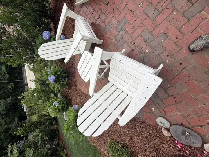 White Adirondack chairs and brick patio after cleaning service at a residential property in Marietta, GA